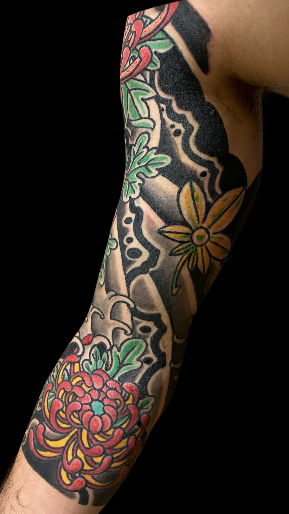 Japanese chrysanthemum and wave sleeve tattoo