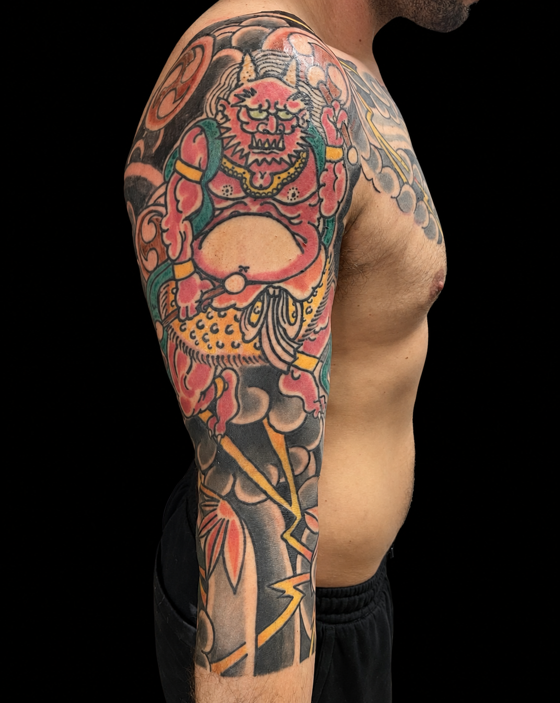 Colour Japanese guardian deity sleeve tattoo
