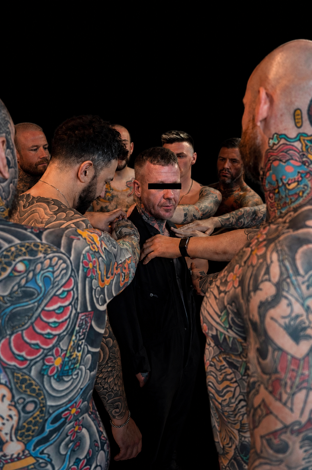 Tattooed clients gathered in the studio