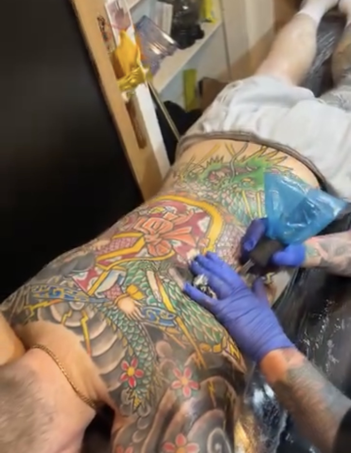 Roddy working on a colourful Japanese backpiece in the studio