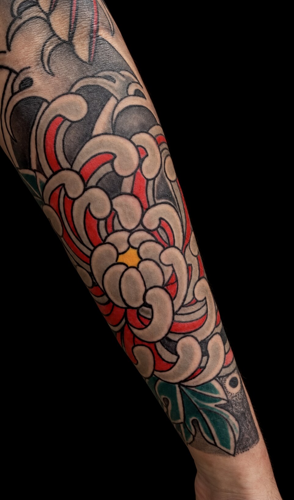 Chrysanthemum and wave sleeve tattoo