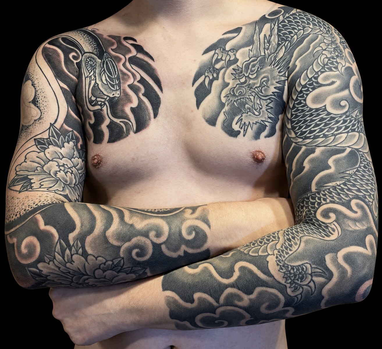 Black-and-grey Japanese dragon sleeves and chest tattoos