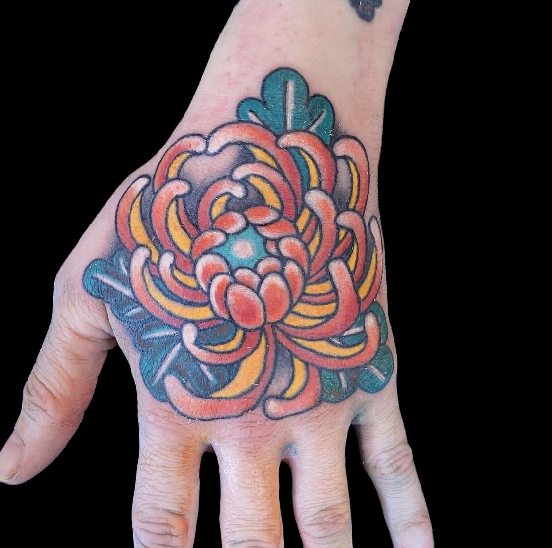 Colour chrysanthemum hand tattoo