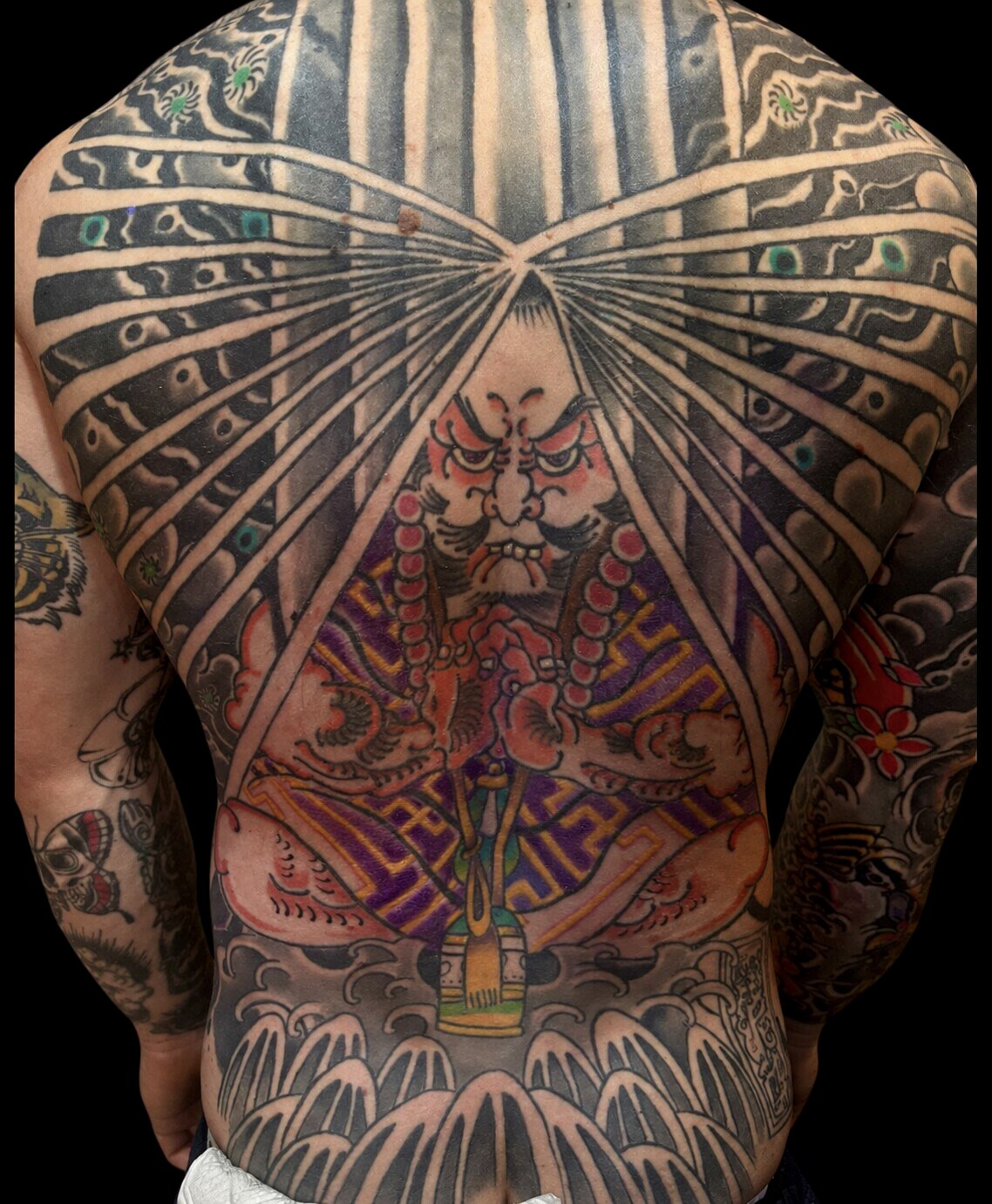 Japanese samurai backpiece framed by radiating black bars
