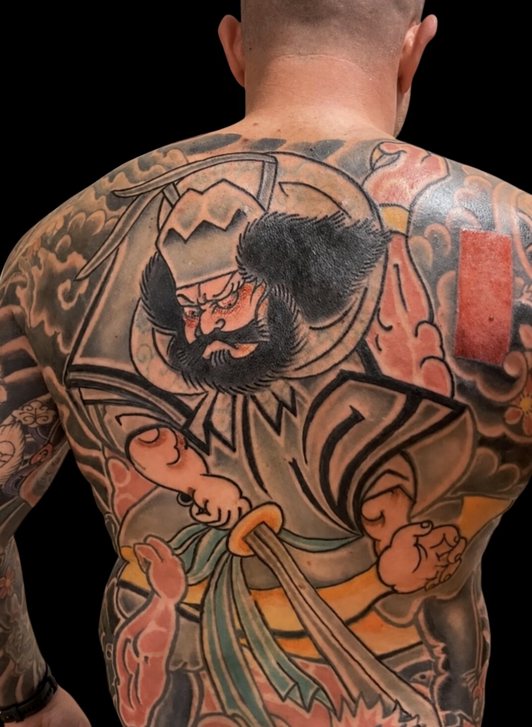 Colour Japanese samurai backpiece on a solid black background