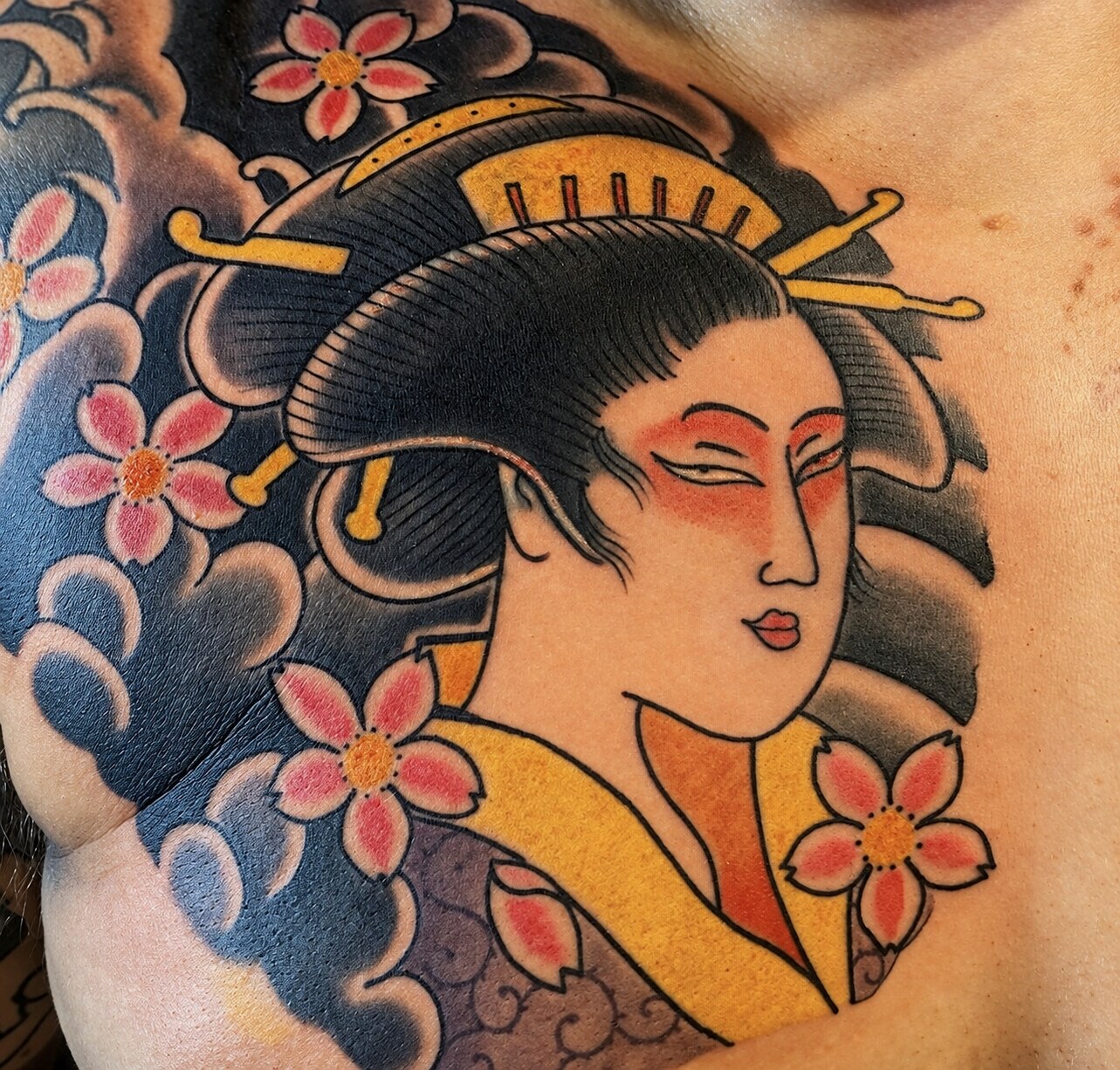 Colour Japanese geisha tattoo framed by cherry blossom and wind bars