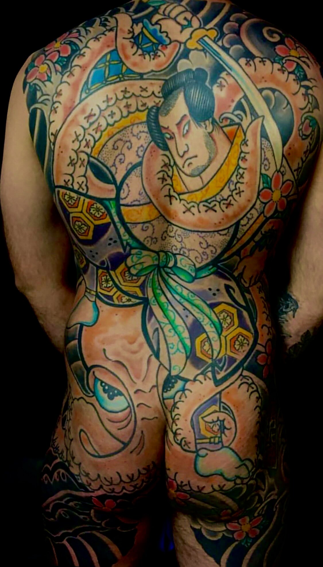 Japanese samurai and tiger backpiece extending onto the legs