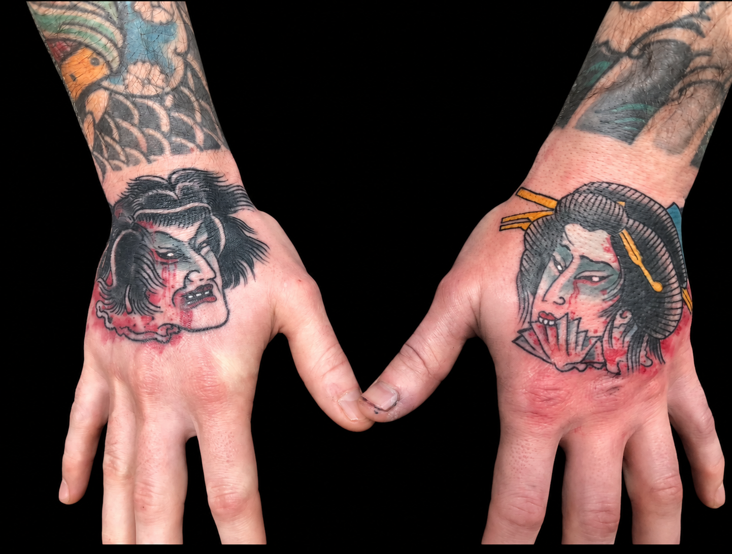 Paired Japanese namakubi hand tattoos