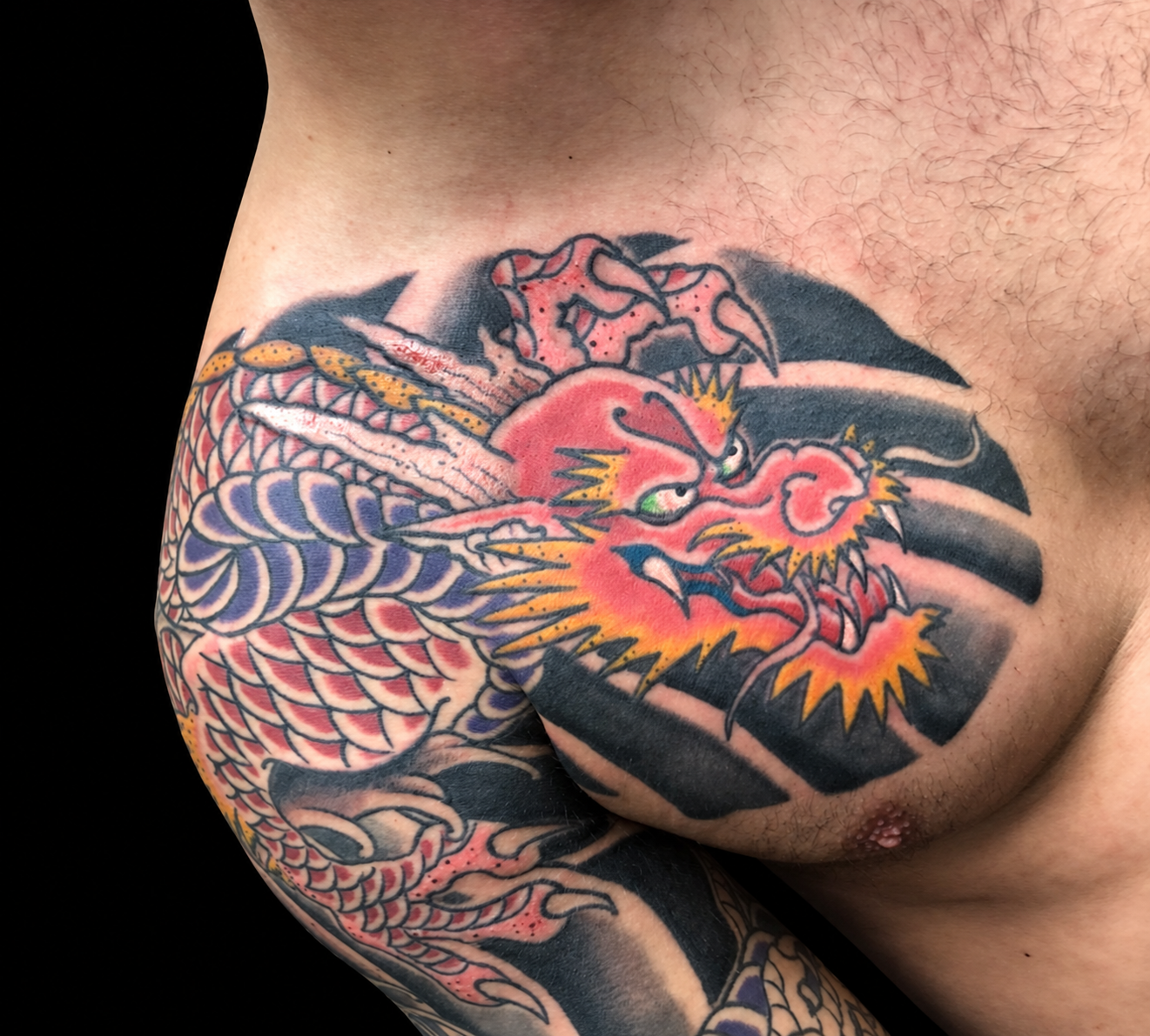 Red Japanese dragon chest and shoulder tattoo