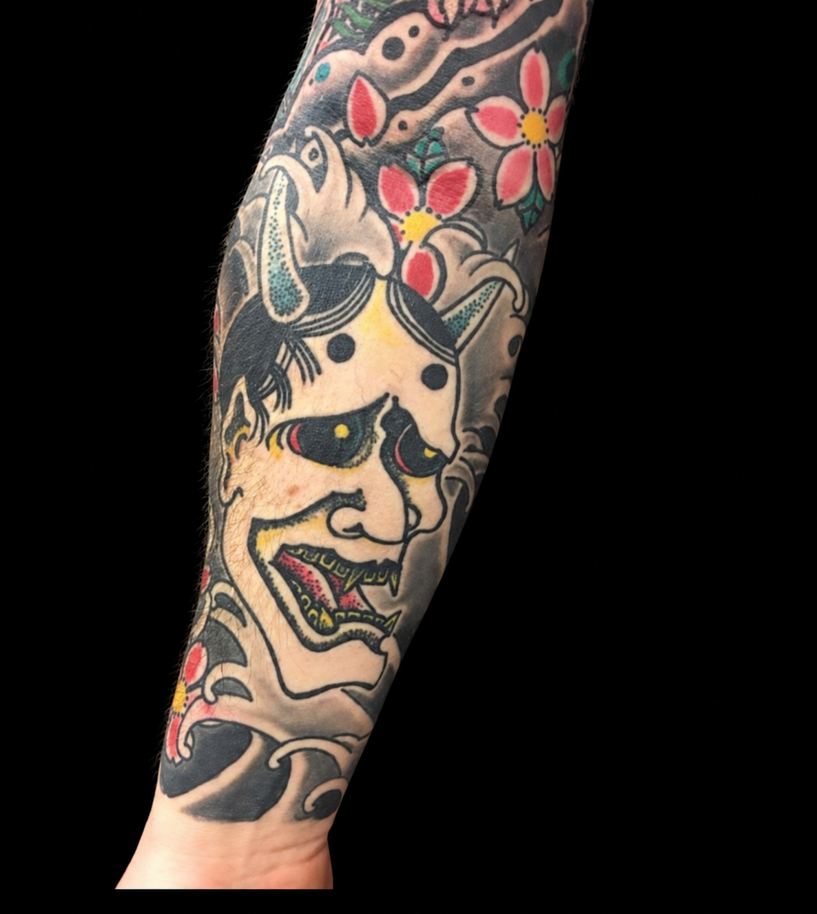 Japanese Hannya and cherry blossom forearm tattoo