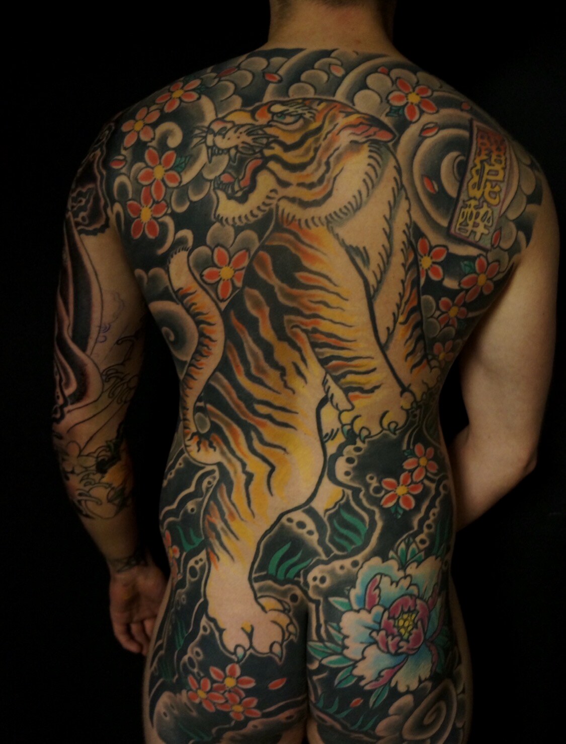 Japanese tiger backpiece extending into a full bodysuit